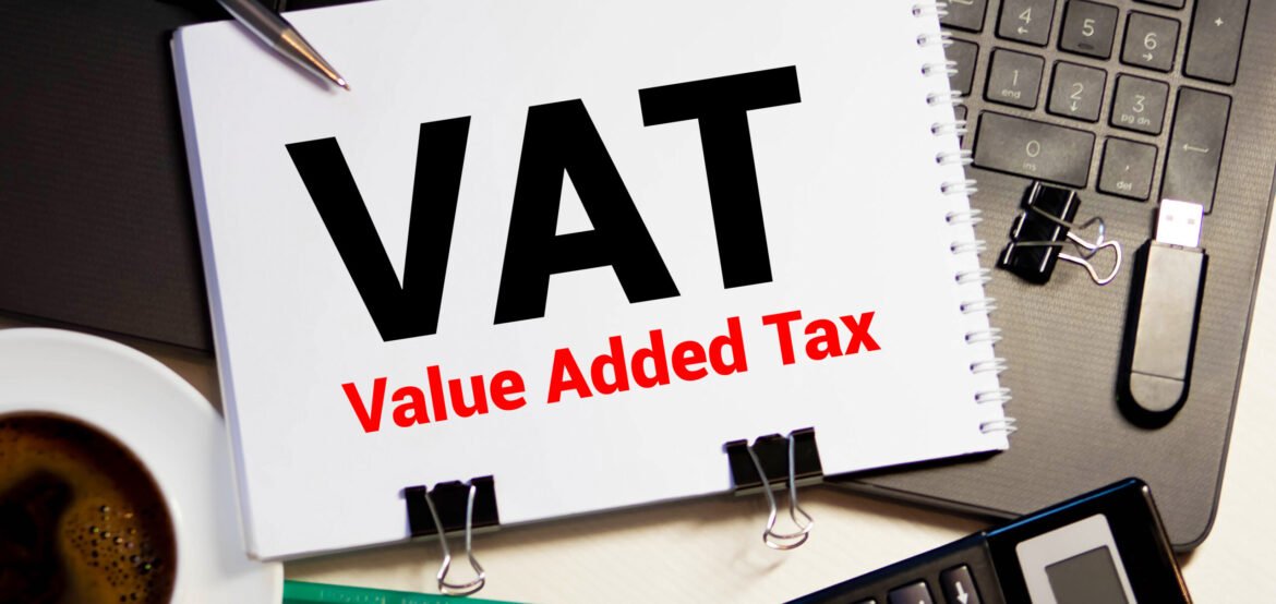 Word VAT on sticker with pen glasses on documents. Tax time. Tax payment deadline. Word VAT on sticker with pen glasses on documents. Tax time. Tax payment deadline